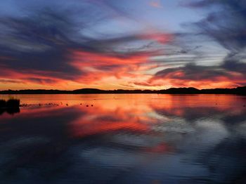 Scenic view of lake at sunset