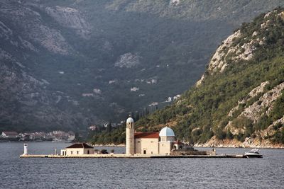 Scenic view of sea with mountains in background