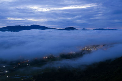 Scenic view of cloudscape over mountains