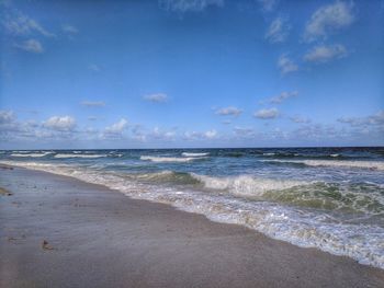 View of beach against blue sky