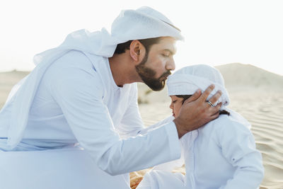 Young couple standing on shore