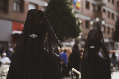 Rear view of manolas in a procession, holy week