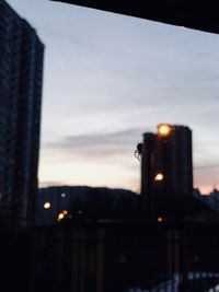 View of city buildings at sunset