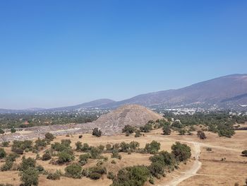 Scenic view of landscape against clear blue sky