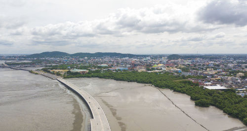 High angle view of townscape and beach against sky