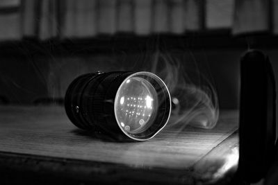 Close-up of electric lamp on table
