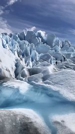 Scenic view of snow covered landscape against sky