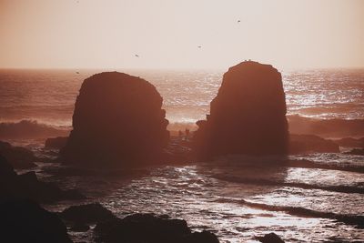 Scenic view of sea against clear sky during sunset