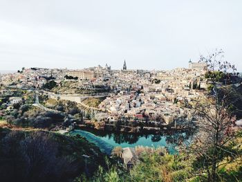 High angle view of river amidst buildings in town