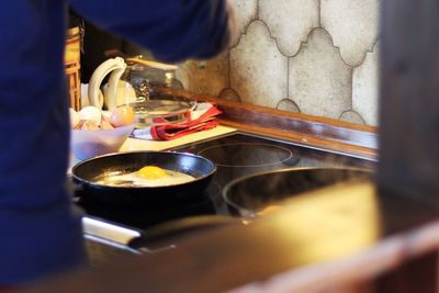 Close-up of woman preparing food at home