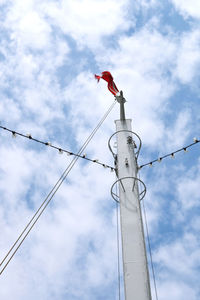 Low angle view of a mast with a flag