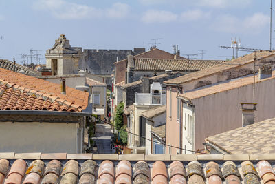 Stack of roof and building against sky