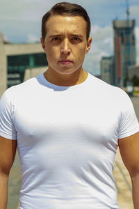 Portrait of young man standing outdoors