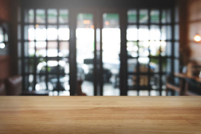 Close-up of window on wooden floor