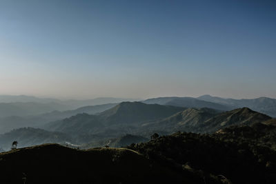 Scenic view of silhouette mountains against clear sky