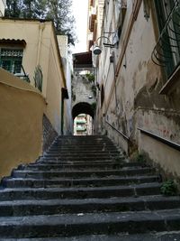 Low angle view of stairs leading towards houses