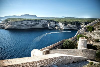 Scenic view of river against blue sky