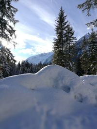 Scenic view of snow covered mountain against sky