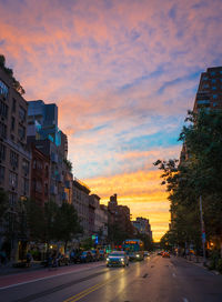 View of city street at sunset
