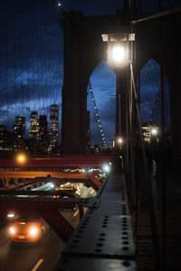 Illuminated bridge at night