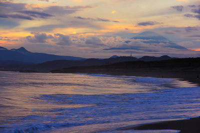 Scenic view of sea against sky during sunset