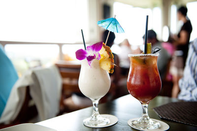 Close-up of cocktails served on table at restaurant