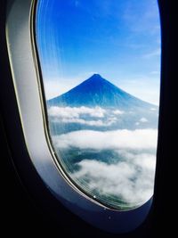Scenic view of mountains against cloudy sky