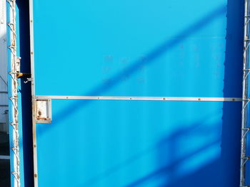 Metal fence against blue sky