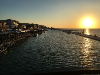 Scenic view of sea against clear sky during sunset