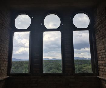 View of historical building seen through arch window