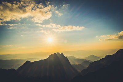 Scenic view of silhouette mountains against sky during sunset