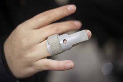 Cropped hands of person with medical equipment