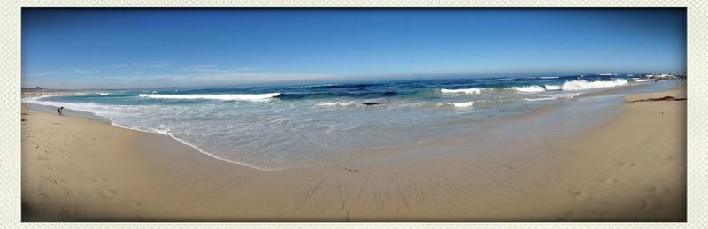 Scenic view of sea against blue sky