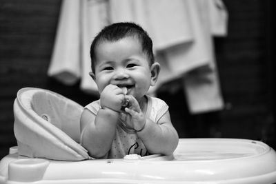 Portrait of cute baby boy at home