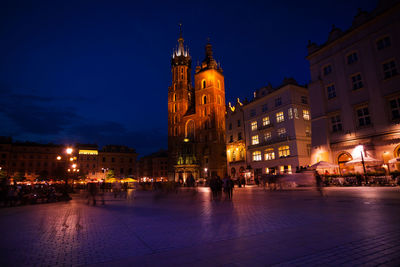 Illuminated buildings in city at night