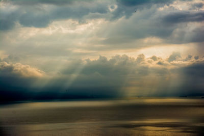 Scenic view of sea against cloudy sky