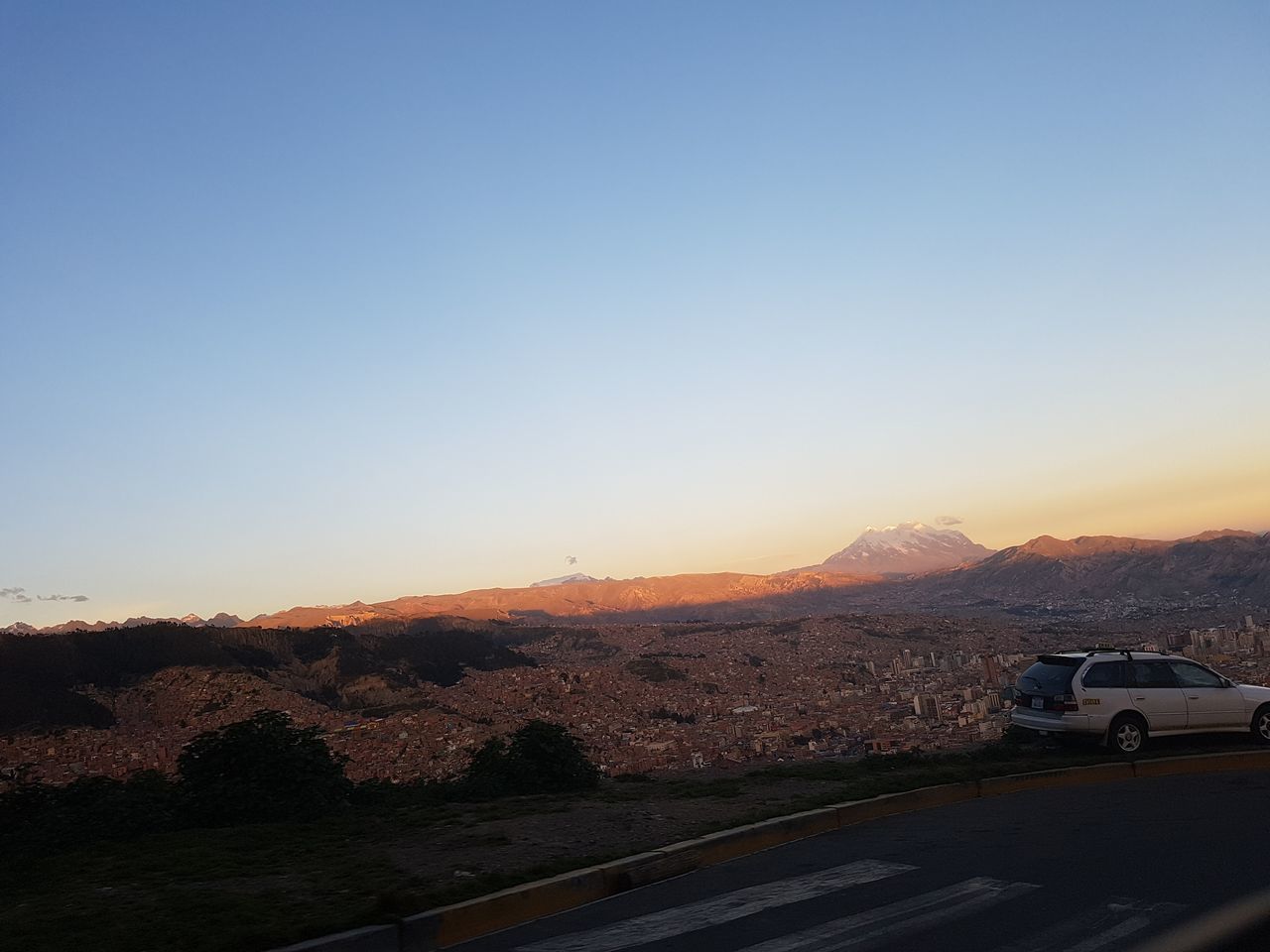 car, transportation, mountain, copy space, land vehicle, road, clear sky, nature, mode of transport, no people, landscape, sunset, scenics, beauty in nature, road trip, outdoors, mountain range, sky, day