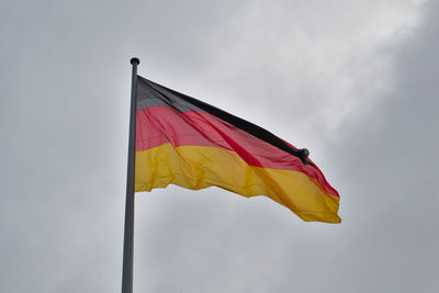 Low angle view of flag against sky