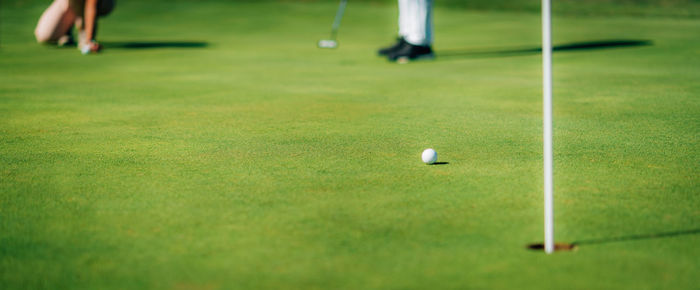 Golf ball approaching the hole