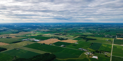 A view of the countryside of wisconsin during the summer with country roads and farms