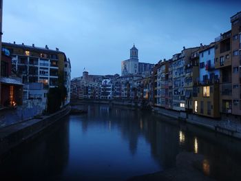 Canal passing through city buildings