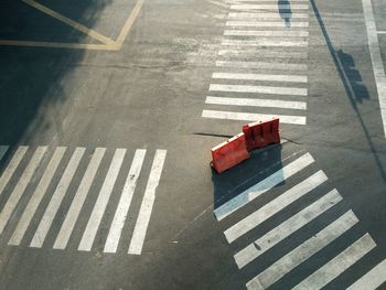 High angle view of road barrier on crosswalk