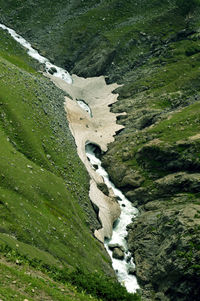 High angle view of stream flowing on land