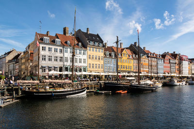 Boats in river in city