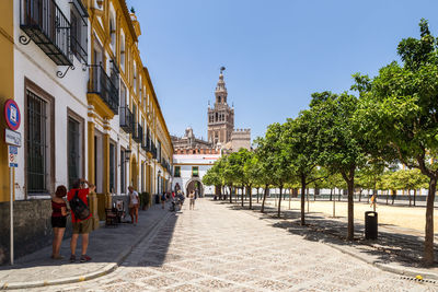 Group of people walking in front of building