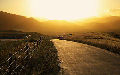 Scenic view of field against sky during sunset