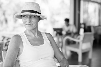 Close-up of woman wearing hat