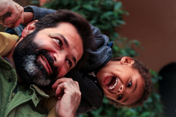 PORTRAIT OF HAPPY FRIENDS AT BABY