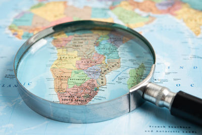 High angle view of magnifying glass on table