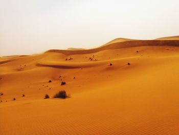 Scenic view of desert against clear sky